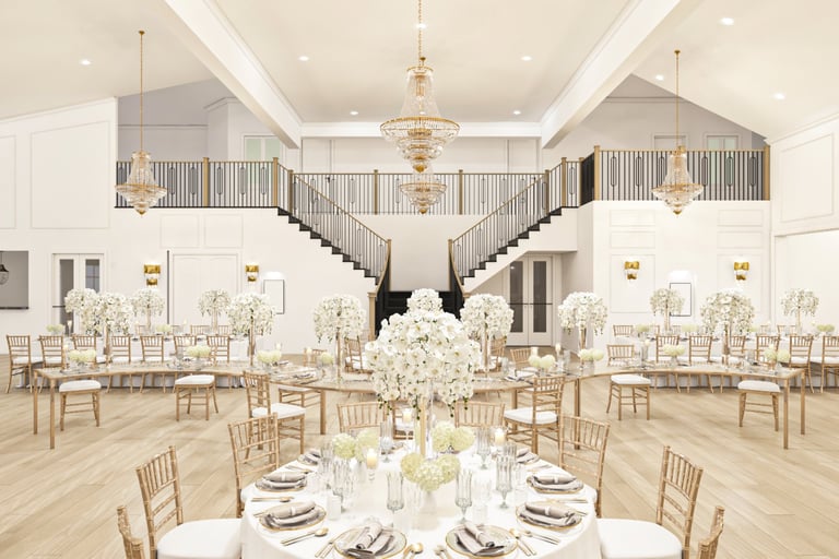 Extravagant ballroom setup featuring white floral decor, golden chairs, ornate chandeliers, and majestic staircases — Venue Finder Guide Tanzania
