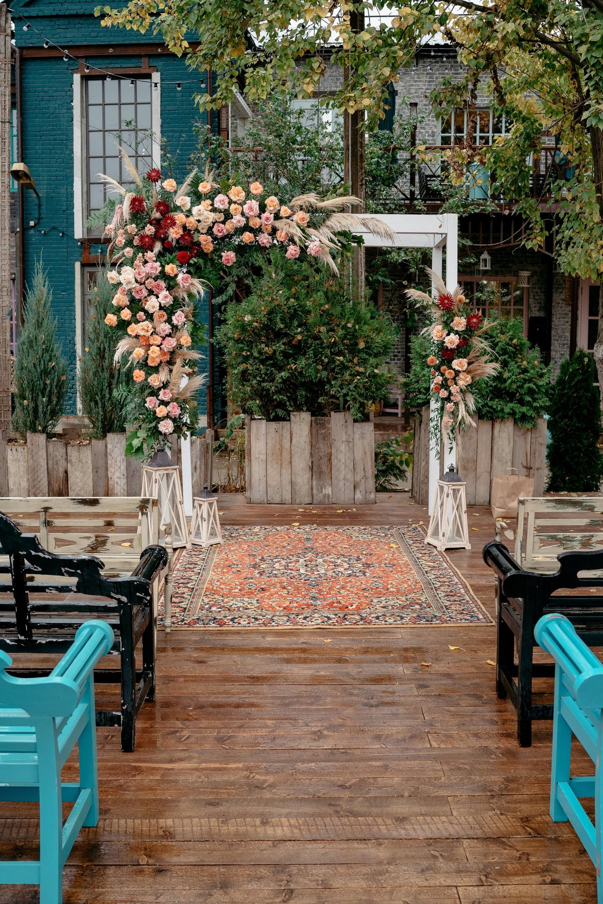 Picturesque rustic outdoor wedding venue at Kilimanjaro Crane Hotel Moshi with wooden arch floral arrangements and greenery