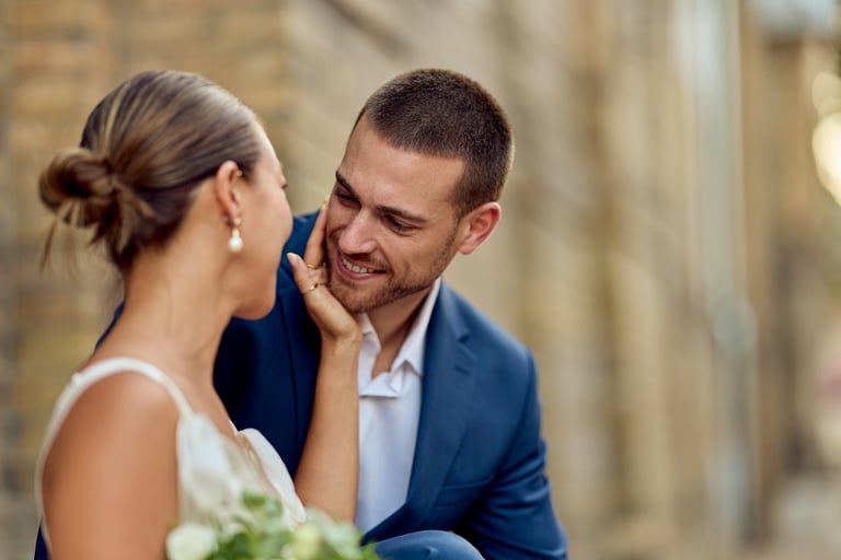 Bride and groom sharing an intimate smile on their wedding day in Tanzania, photographed by Royal Wedding Cinema