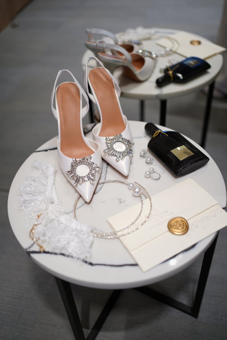 Elegant bridal high heels with crystal embellishments next to a wedding invitation sealed with a heart wax stamp — AI Wedding Stylist tool by Royal Wedding Cinema Tanzania
