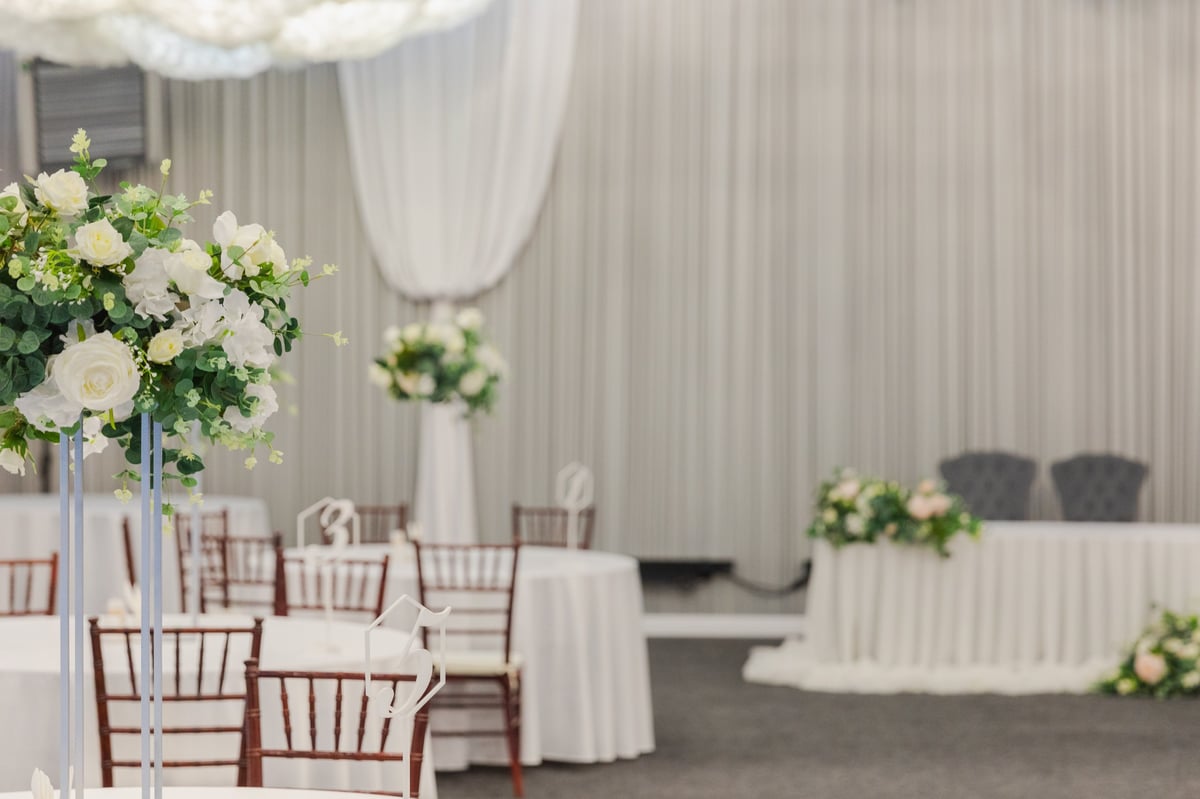 Luxury wedding banquet decoration at Hotel Dodoma Paradise with white flower arrangements and elegant table settings