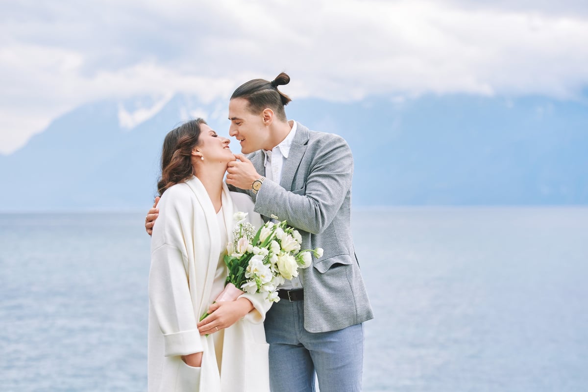 Romantic couple by lake with mountain view at Moshi Kilimanjaro wedding celebration