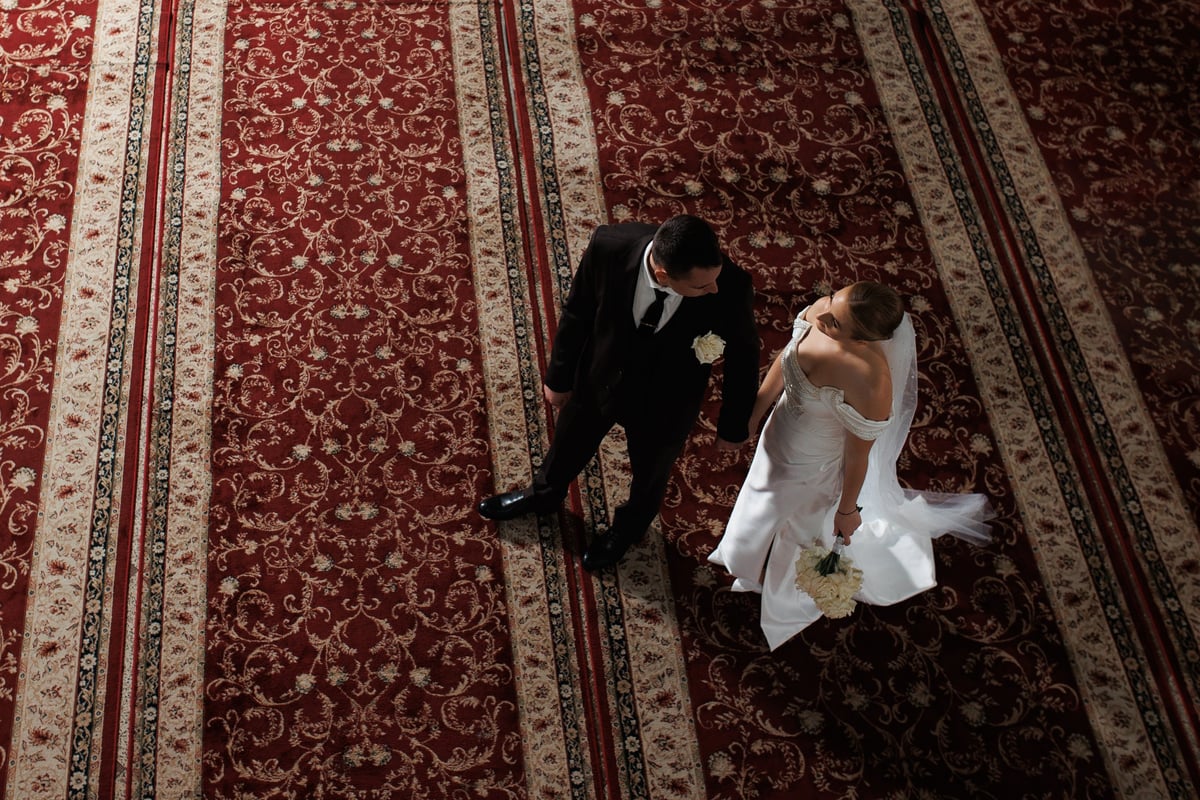 Bride and groom walking together at their Dodoma wedding reception