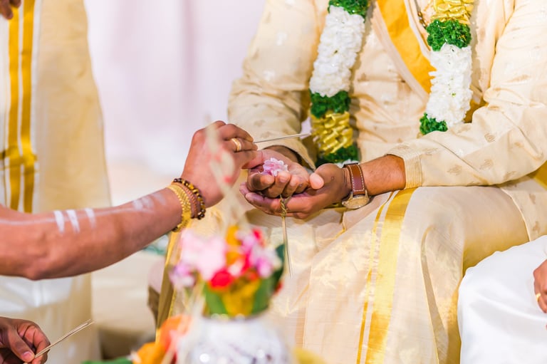 Indian Hindu wedding ceremony ritual items hands close up