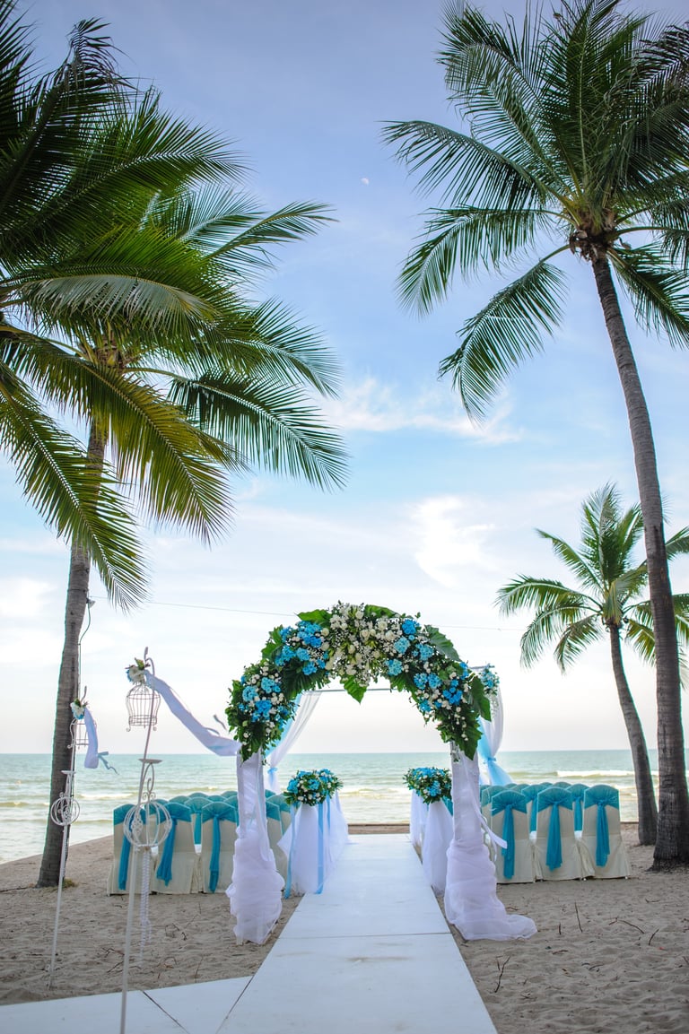 Floral arrangement backdrop at Lake Tanganyika Hotel Kigoma wedding ceremony on the beach