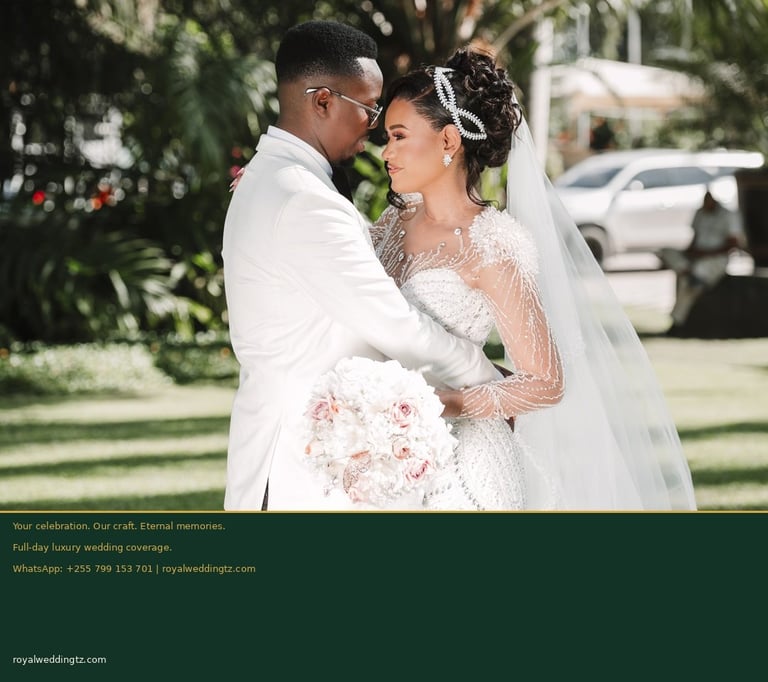 Bride and groom in white wedding attire embracing outdoors, bride holding pink bouquet