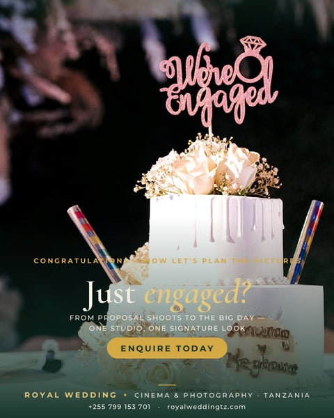 Elegant engagement cake with fresh flowers and rose gold topper on white drip fondant, styled for wedding photography promotion