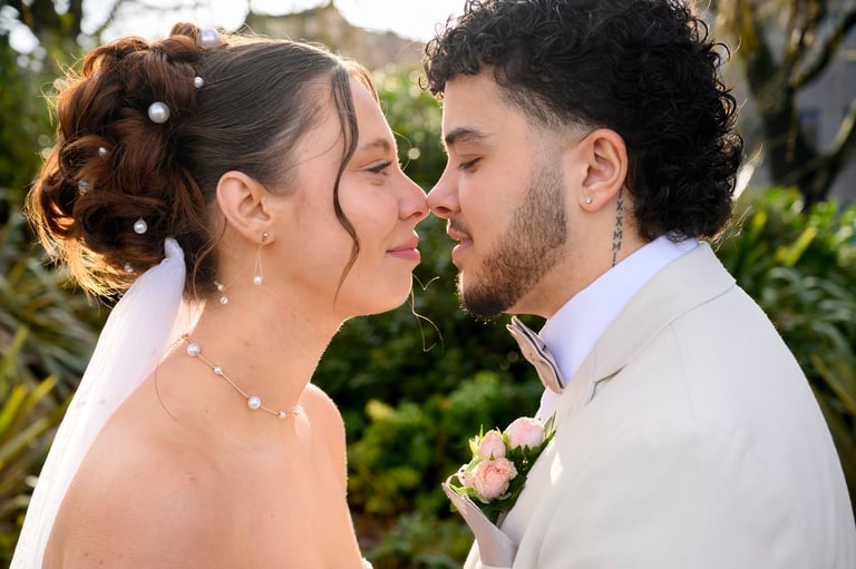 Bride and groom about to kiss at their wedding ceremony in a garden setting — best wedding photographer Tanzania Dar es Salaam by Royal Wedding Cinema & Photography