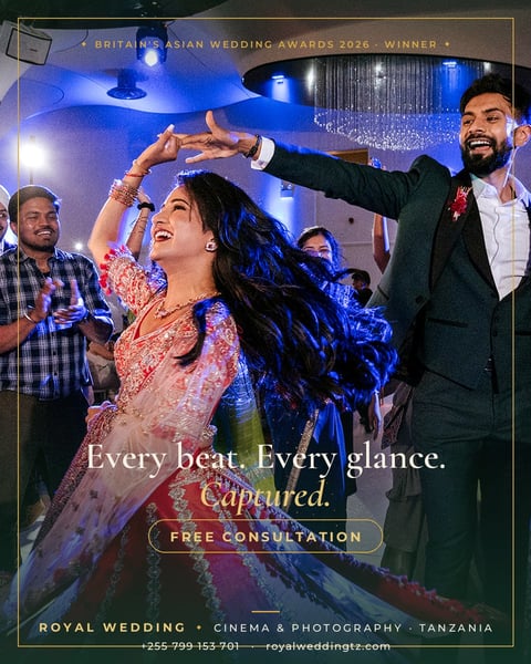 Couple dancing at a luxury wedding celebration with blue ambient lighting and guests around them at Britains Asian Wedding Awards 2026