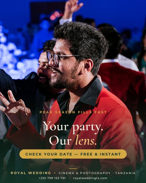 Man in red shirt with glasses at party, smiling with raised hand. Text reads: Your party. Our lens. Check your date - free and instant. Royal Wedding Cinema and Photography Tanzania.