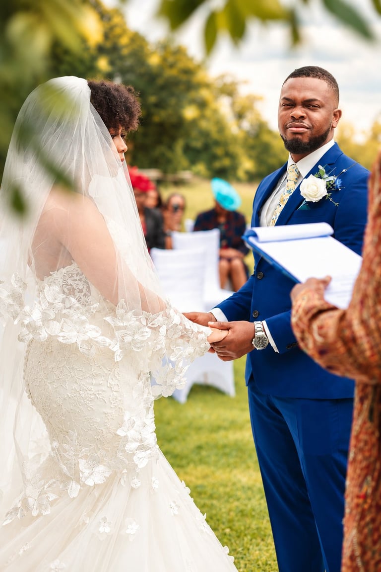 Bride and groom exchanging vows during an outdoor garden wedding ceremony in a green park setting, captured by a Tanzania wedding photographer