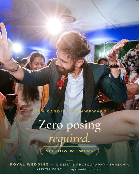 Groom with arms raised dancing at wedding reception with guests, promotional image for royal wedding cinema and photography services